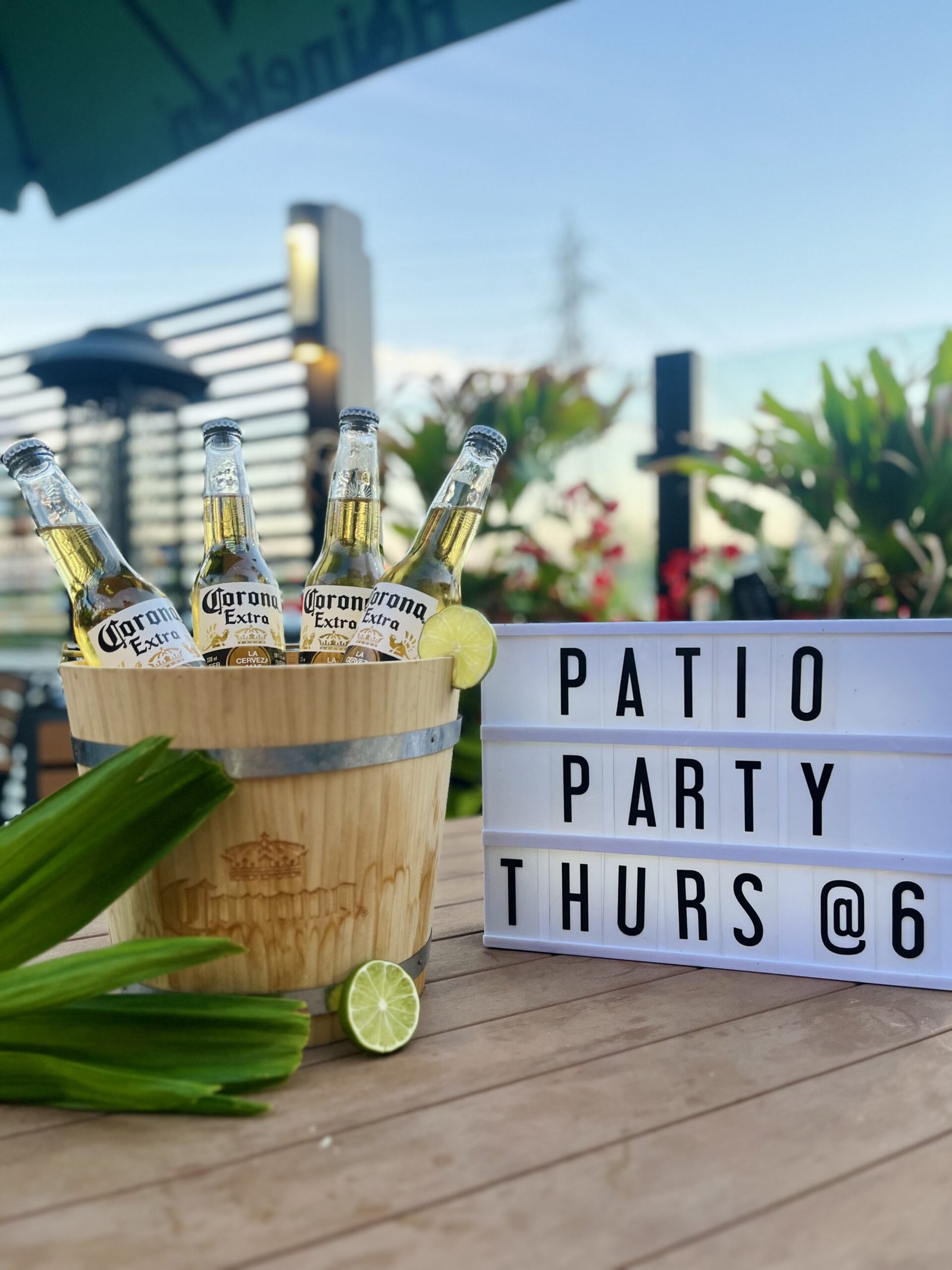 Instagram post of a bucket of beers with a sign that says patio party thurs @ 6